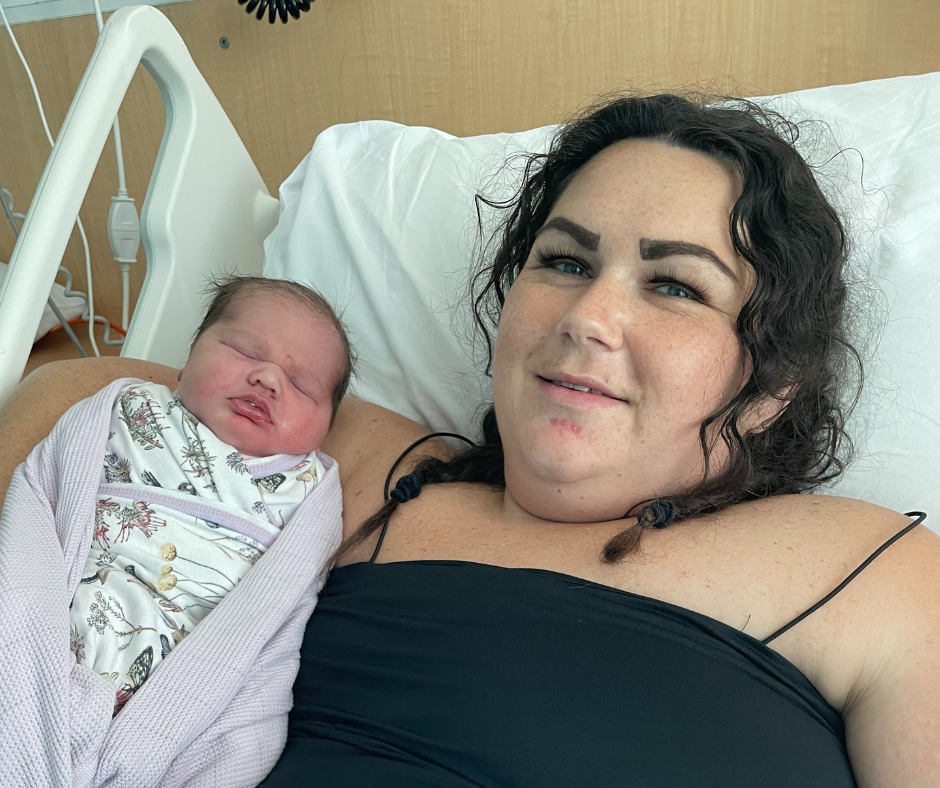 Photo of newborn baby and mother in a hospital setting.