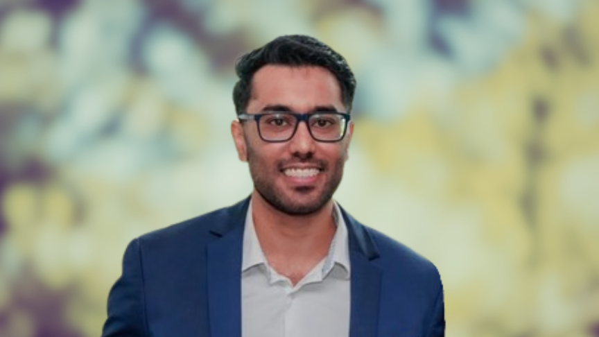 Portrait of male doctor in front of a blurred background of trees