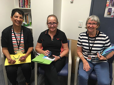 West Moreton Health social workers Sara Ellis, Catherine Stanbrook and Lynette Kindt during a team briefing in Townsville.