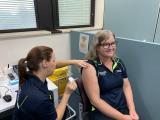 Public Health nurse Emma Hutton vaccinates Infection Prevention Clinical Nurse Consultant Monica Prior against COVID-19.